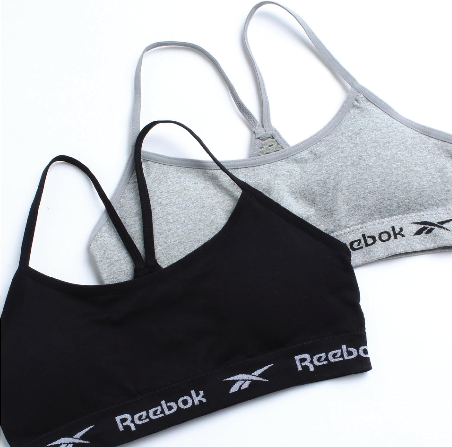 image:imageReebok Girls Training Bras 2 Pack Racerback Bralettes Removable Pads SuperSoft Fabric with a Sporty RacerStyle Back Fit Stays Comfortably in Place Through Dance Gym and PlayBlackGrey