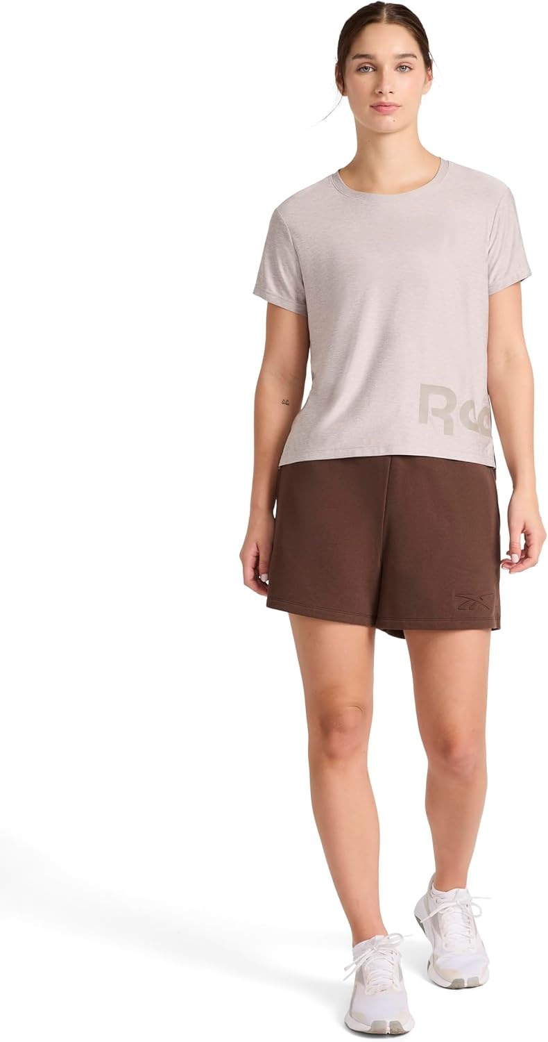 image:imageReebok Womens Wrap Around Wordmark Graphic Crewneck TShirt Standard Fit Lightweight Stretch Poly Marled Jersey FabricOpal Grey Heather
