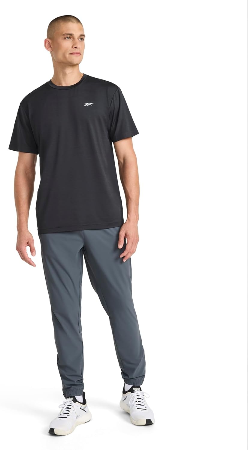 image:imageReebok Mens Reflective Small Logo Crewneck TShirt Standard Fit Lightweight Cool Touch Jersey FabricBlack Heather Lightning