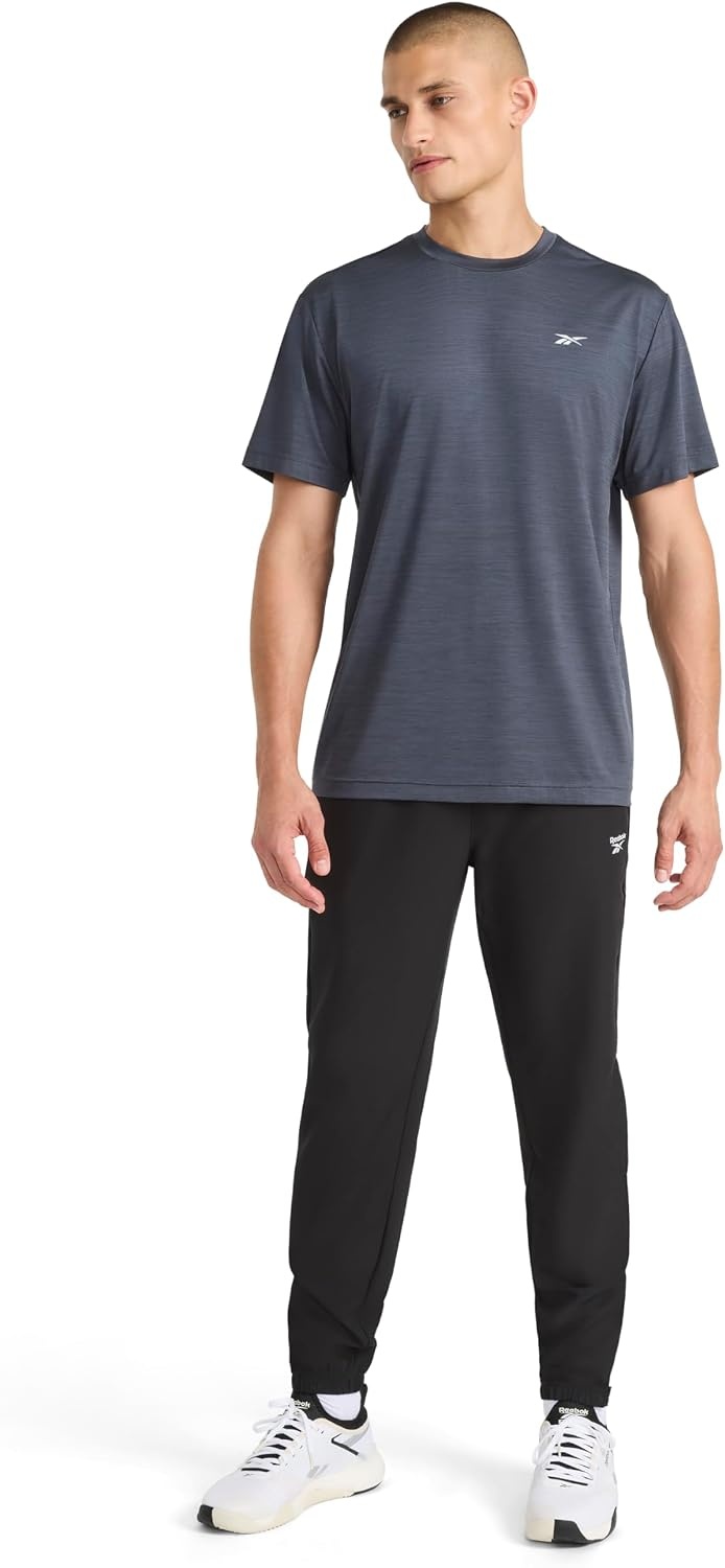 image:imageReebok Mens Reflective Small Logo Crewneck TShirt Standard Fit Lightweight Cool Touch Jersey FabricEbony Heather Lightning