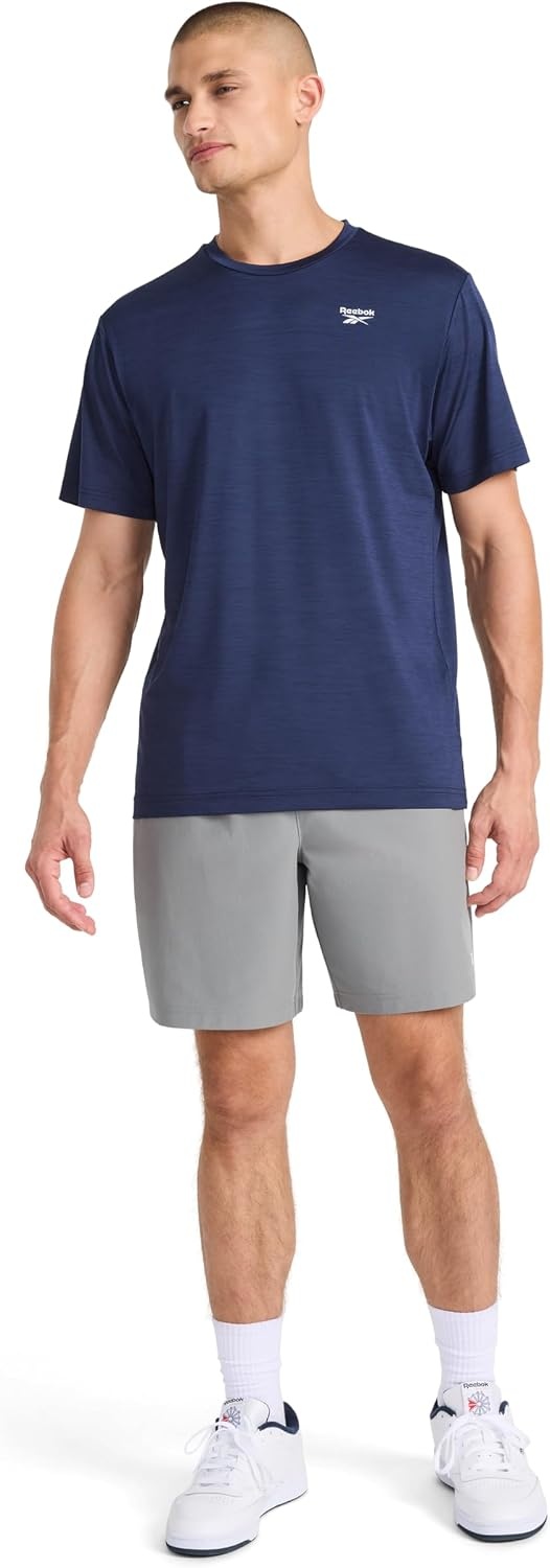 image:imageReebok Mens Reflective Small Logo Crewneck TShirt Standard Fit Lightweight Cool Touch Jersey FabricVector Navy Heather Showdown