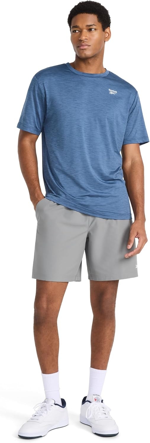 image:imageReebok Mens Reflective Small Logo Crewneck TShirt Standard Fit Lightweight Cool Touch Jersey FabricVector Shadow Heather Showdown