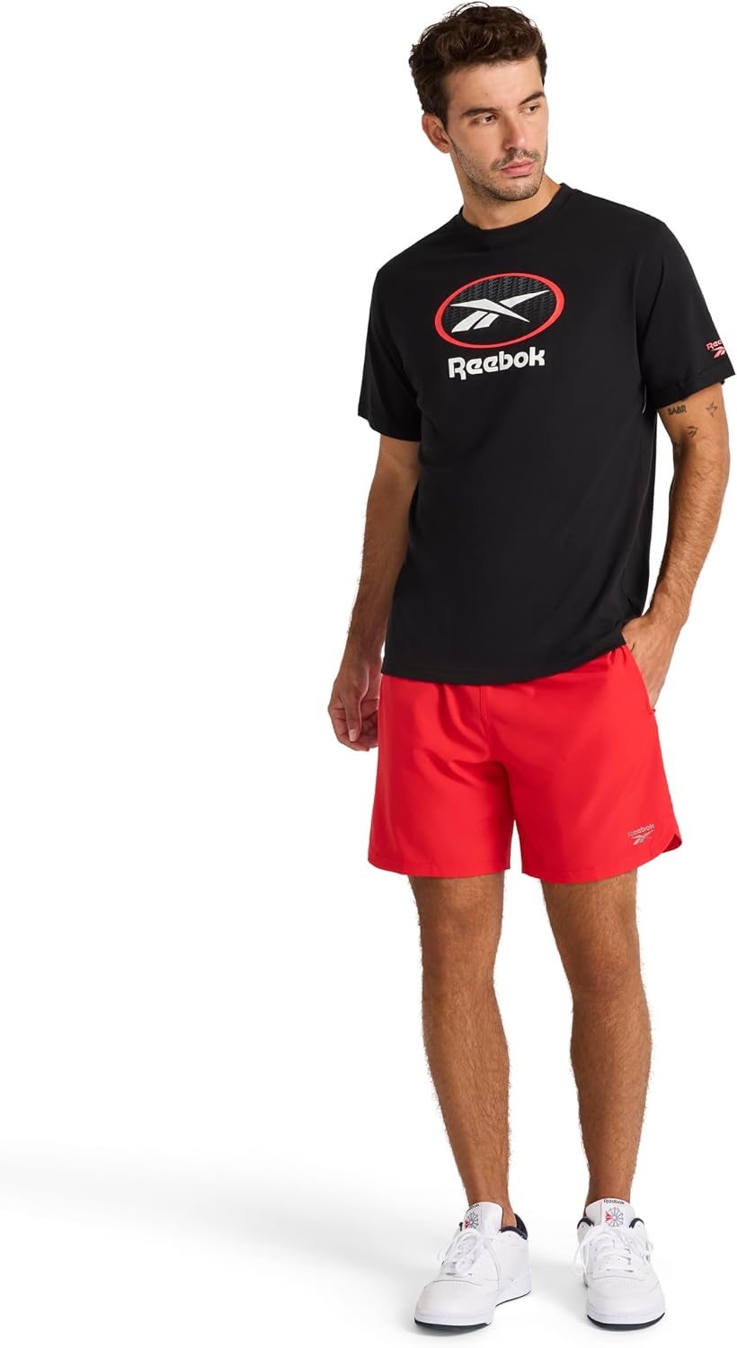 image:imageReebok Mens Short Sleeve Graphic Crewneck TShirt Standard Fit Lightweight CottonPoly FabricBlack Vertigo