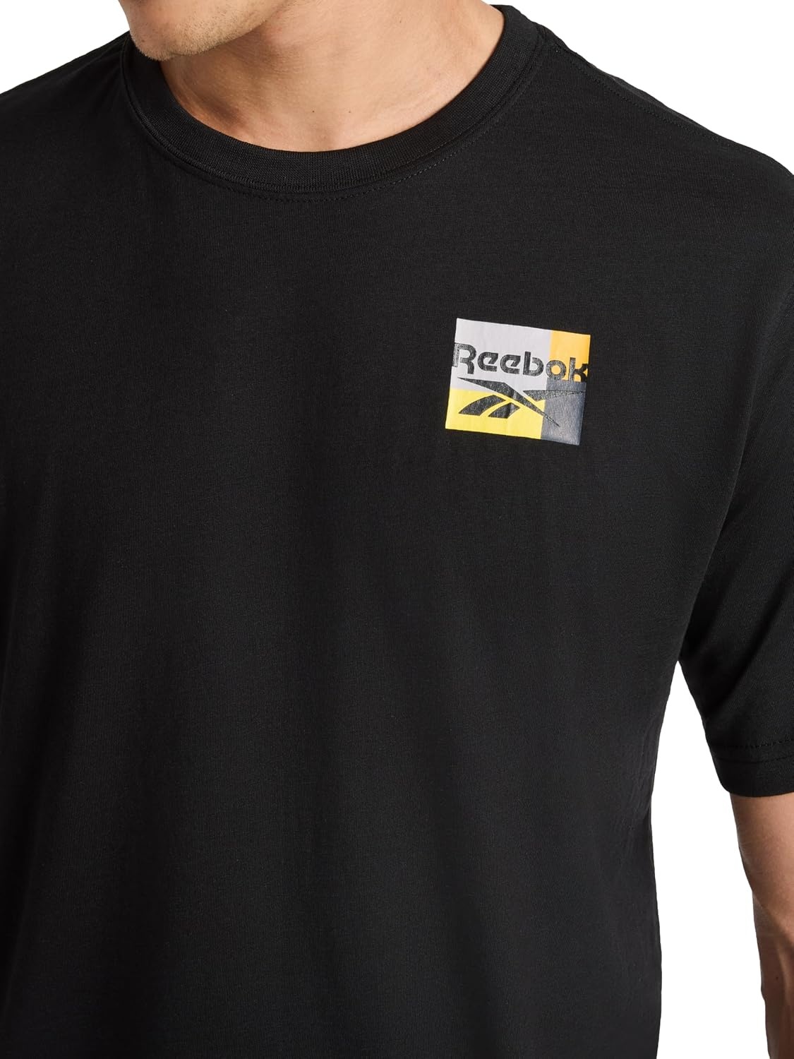 image:imageReebok Mens Small Logo Crewneck TShirt Standard Fit Lightweight CottonPoly Jersey FabricBlack Bebop