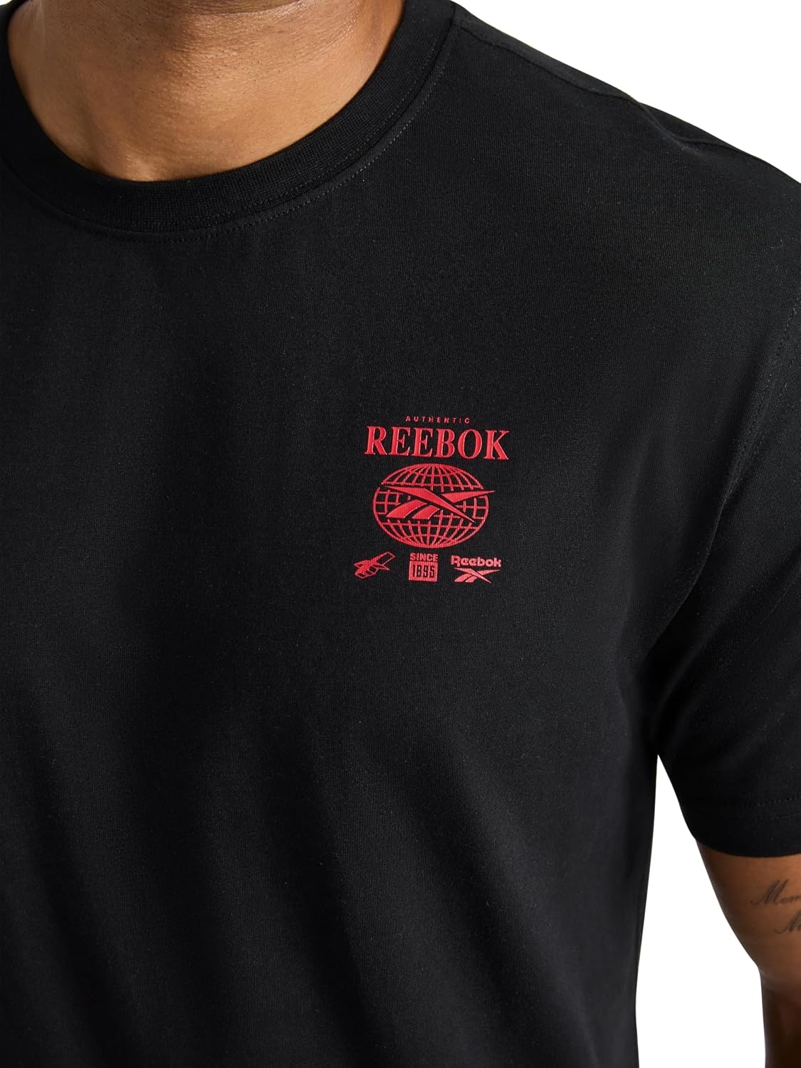 image:imageReebok Mens Small Logo Crewneck TShirt Standard Fit Lightweight CottonPoly Jersey FabricBlack Globe