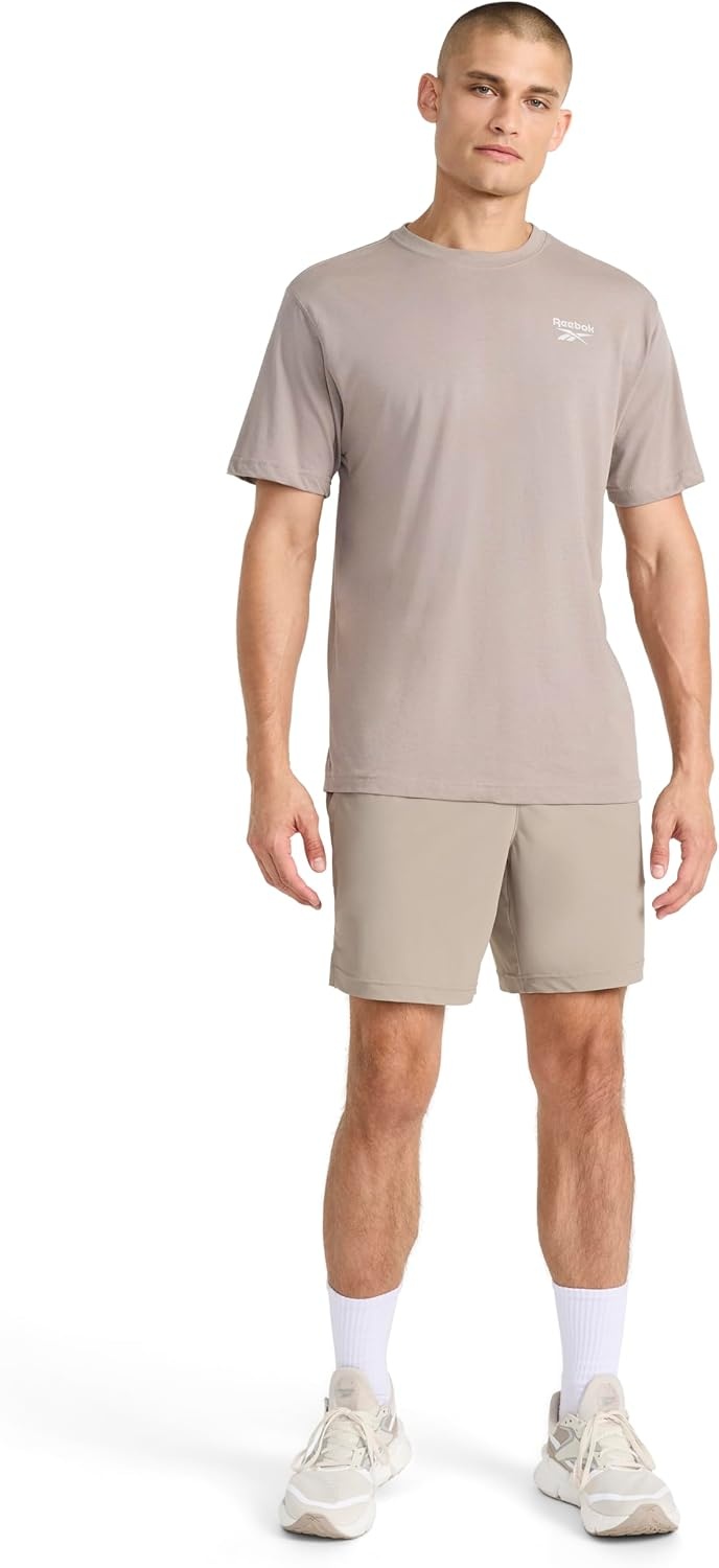 image:imageReebok Mens Small Logo Crewneck TShirt Standard Fit Lightweight CottonPoly Jersey FabricDriftwood Proto