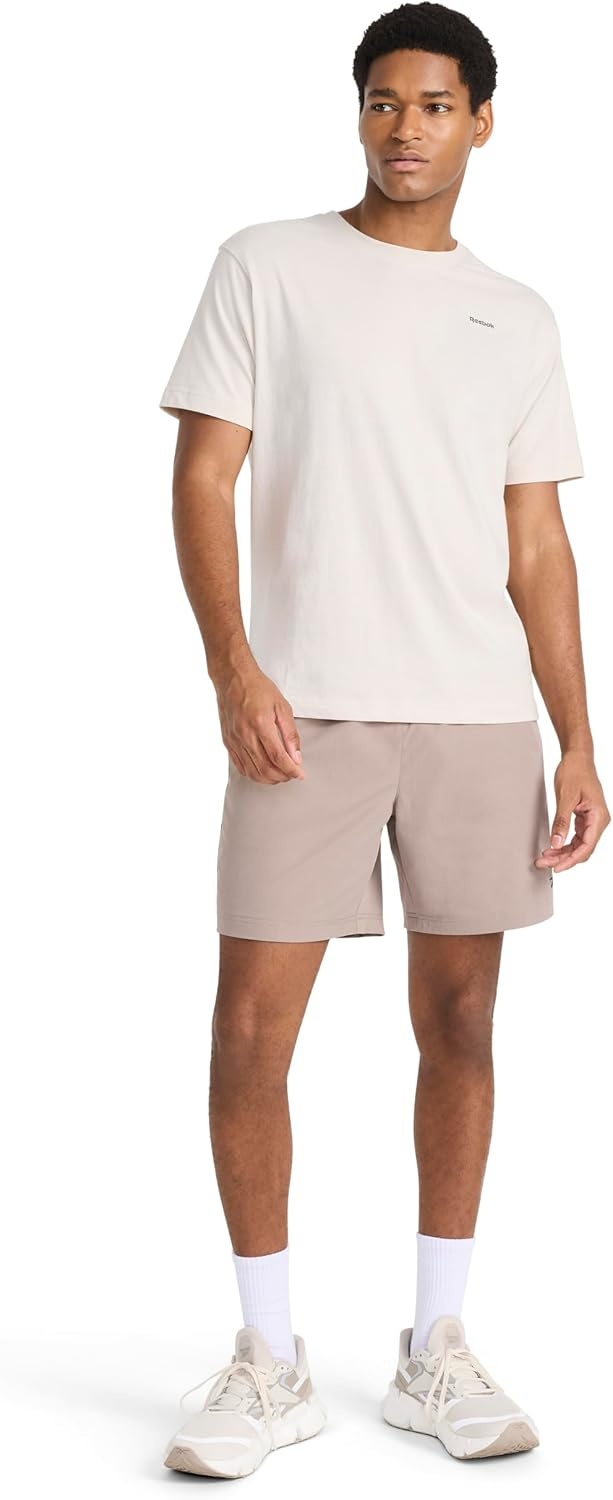 image:imageReebok Mens Small Logo Crewneck TShirt Standard Fit Lightweight CottonPoly Jersey FabricPumice Stone Schematic