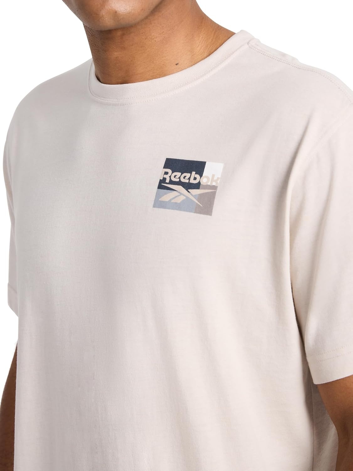 image:imageReebok Mens Small Logo Crewneck TShirt Standard Fit Lightweight CottonPoly Jersey FabricSilver Cloud Bebop