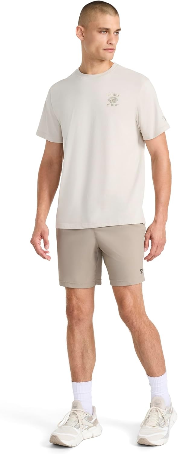 image:imageReebok Mens Small Logo Crewneck TShirt Standard Fit Lightweight CottonPoly Jersey FabricSilver Cloud Globe