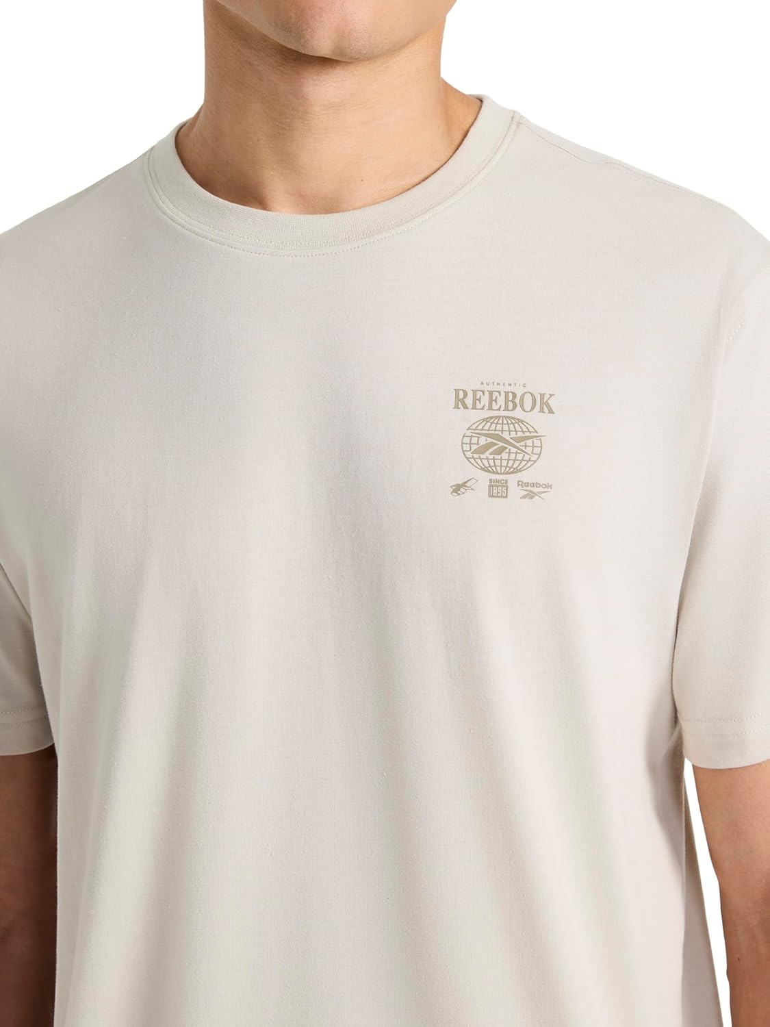 image:imageReebok Mens Small Logo Crewneck TShirt Standard Fit Lightweight CottonPoly Jersey FabricSilver Cloud Globe