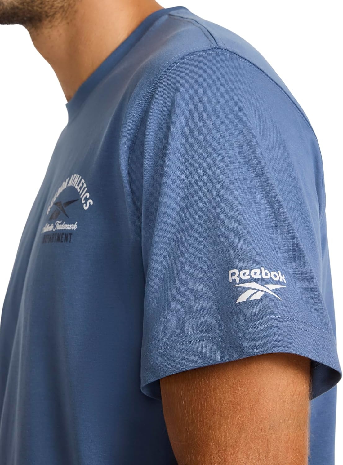 image:imageReebok Mens Small Logo Crewneck TShirt Standard Fit Lightweight CottonPoly Jersey FabricVector Shadow Athletics Dept