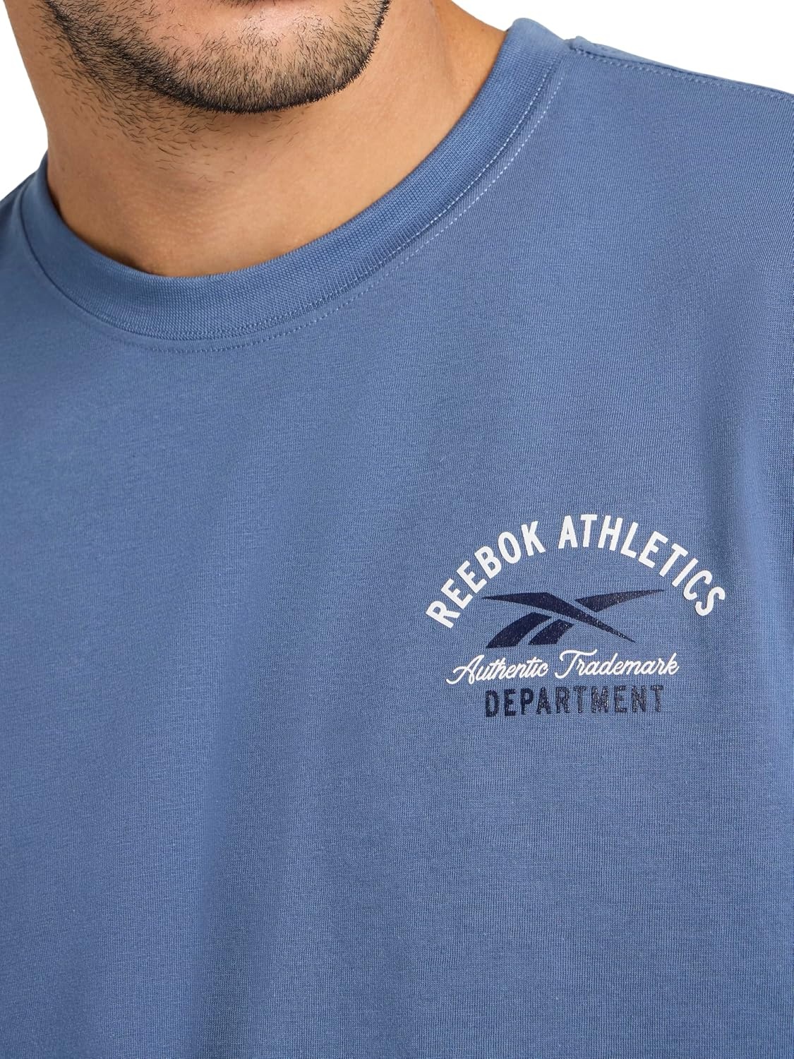 image:imageReebok Mens Small Logo Crewneck TShirt Standard Fit Lightweight CottonPoly Jersey FabricVector Shadow Athletics Dept