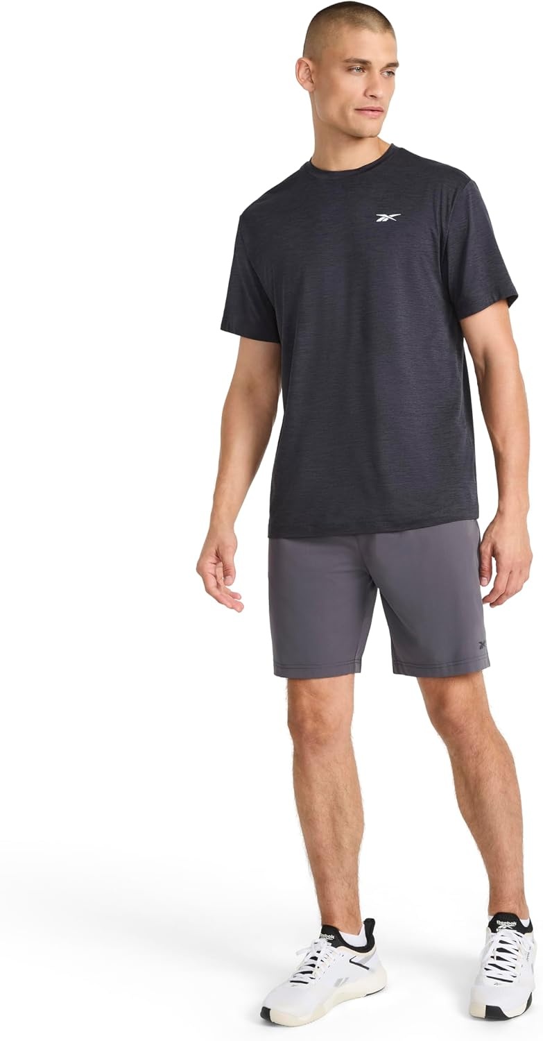 image:imageReebok Mens Strike Short Sleeve Crewneck TShirt Standard Fit Lightweight Stretch Poly Jersey FabricBlack Heather